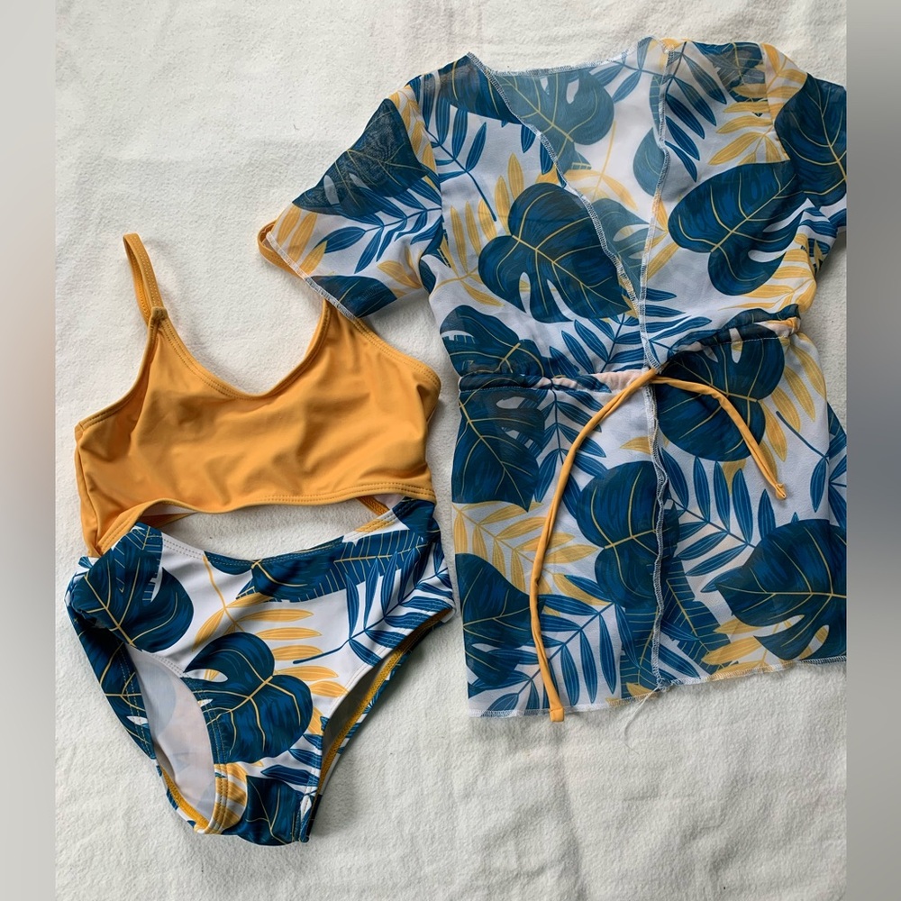 Little girls swimsuit with matching cover up size tags states 5Y